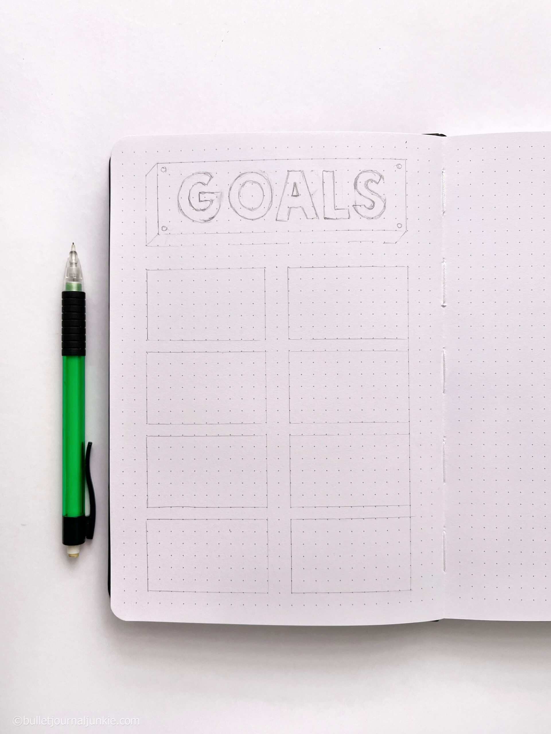 Pencil lines on a bullet journal grid page.
