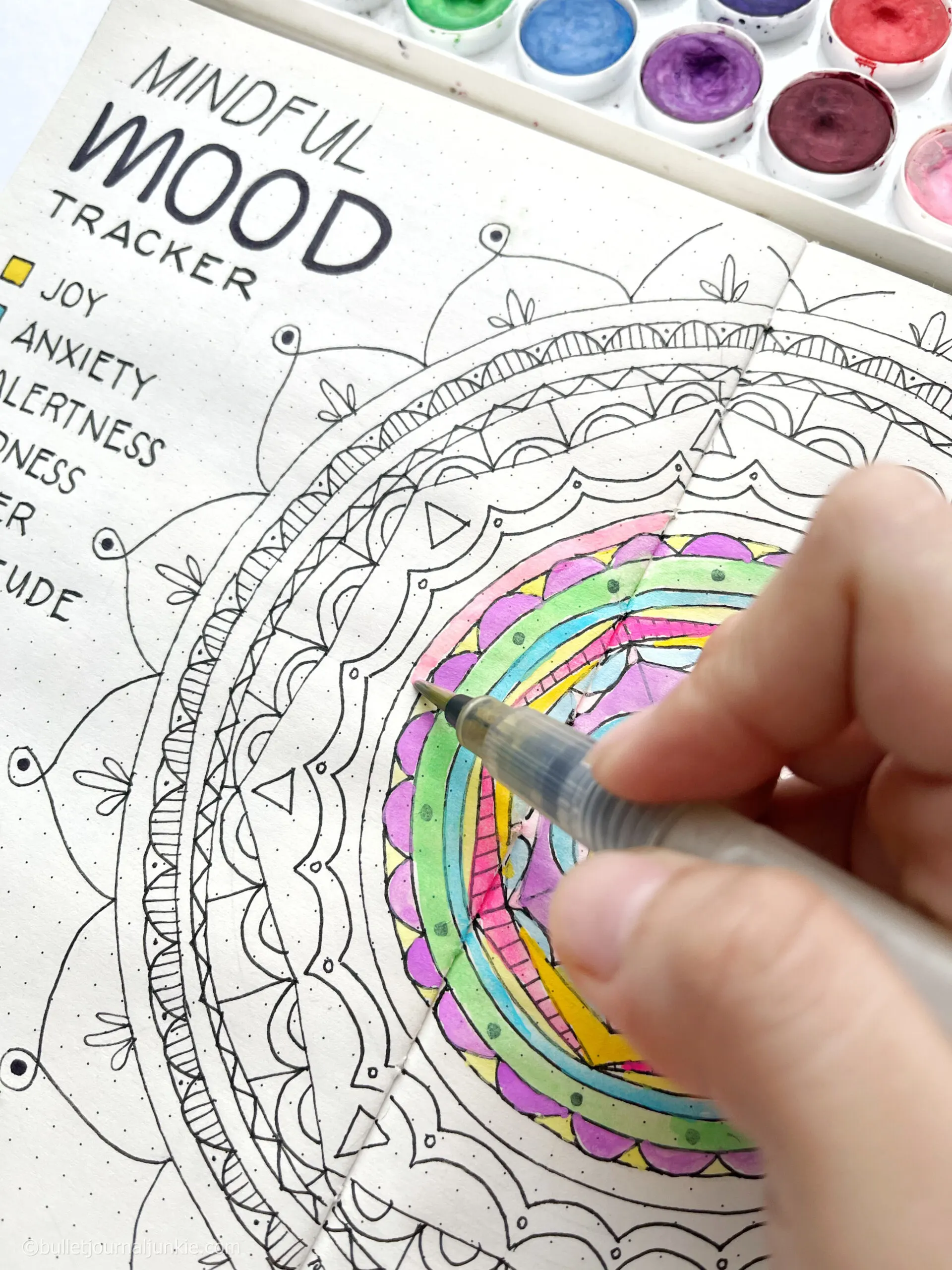 painting a mood mandala in a bullet journal