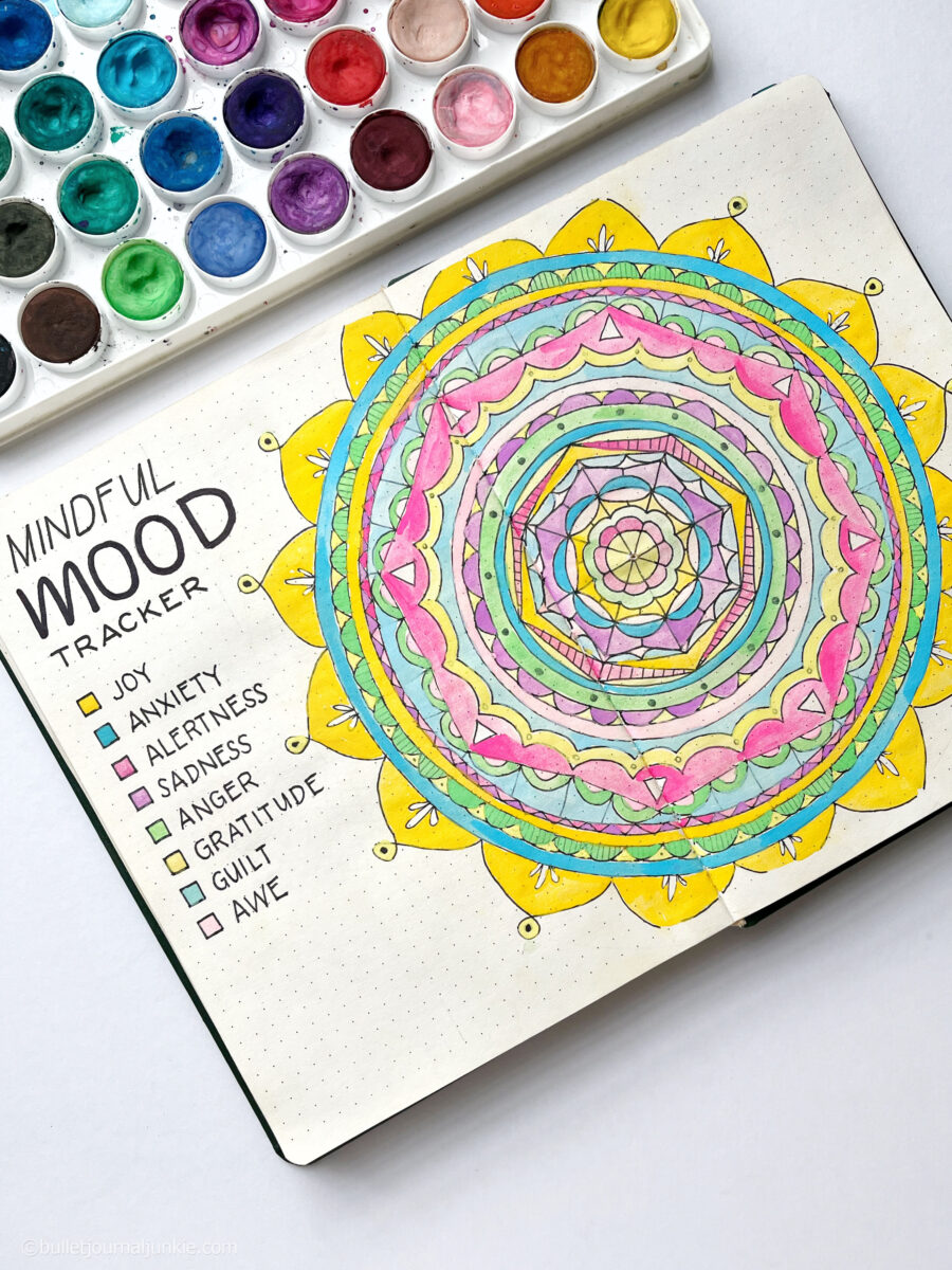 A mandala in a bullet journal being used to track moods.