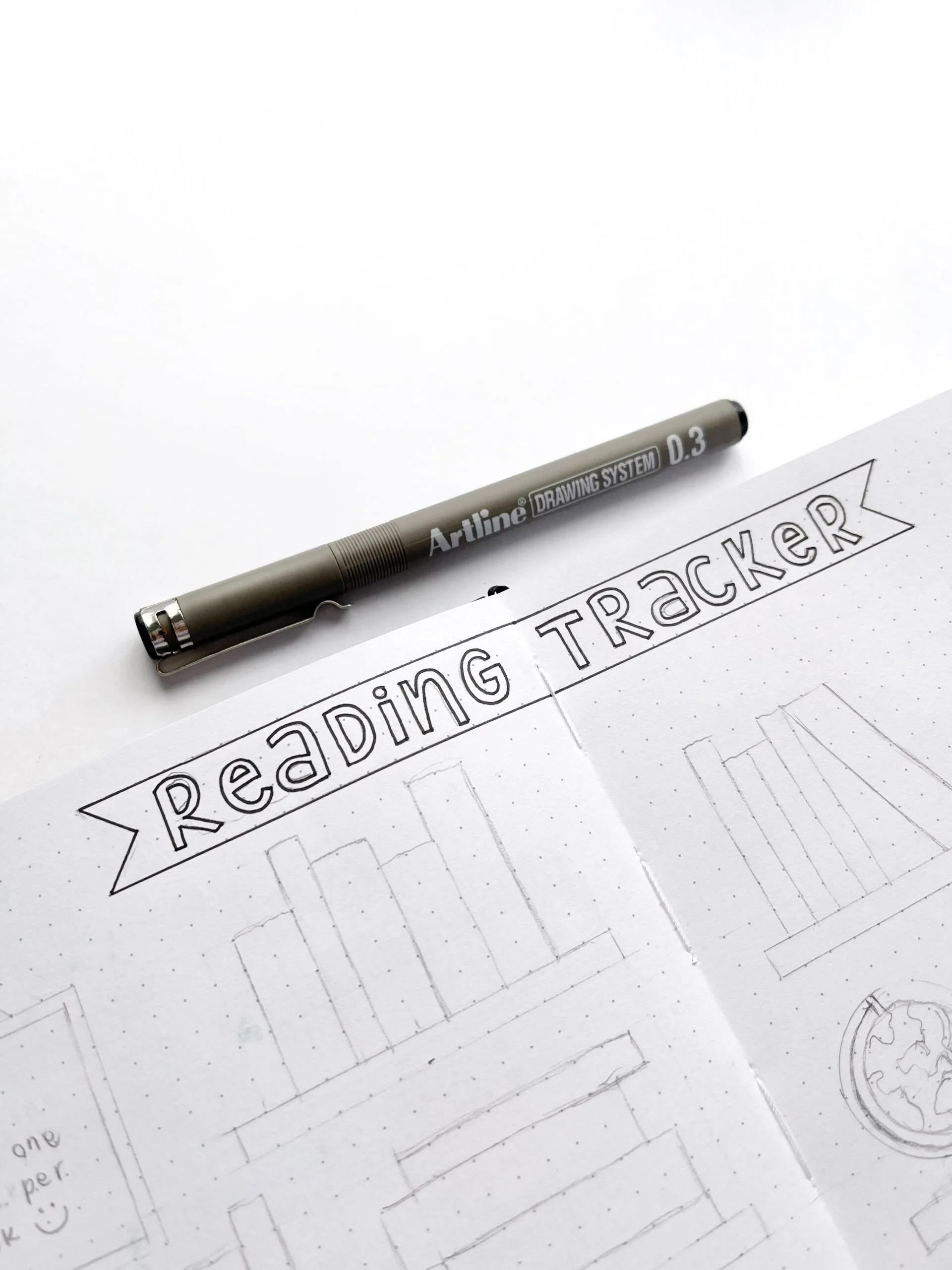 Outline of the books drawn with a pencil for the reading tracker layout.